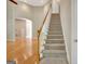 Open concept foyer with hardwood and carpeted stairs at 1619 Cascade Overlook, Peachtree City, GA 30269