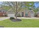 Beautiful brick home with a well-maintained lawn, mature landscaping, and inviting double door entrance at 1619 Cascade Overlook, Peachtree City, GA 30269