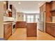 Bright kitchen with island, stainless steel appliances, granite counters, and ample cabinet space at 1619 Cascade Overlook, Peachtree City, GA 30269