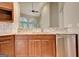 View of granite countertop, stainless steel dishwasher, and kitchen sink at 1619 Cascade Overlook, Peachtree City, GA 30269