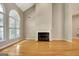 Bright living room offers hardwood flooring, fireplace, vaulted ceiling, and lots of natural light at 1619 Cascade Overlook, Peachtree City, GA 30269