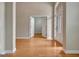 Bright living room with hardwood floors and an open doorway leading to another room in the house at 1619 Cascade Overlook, Peachtree City, GA 30269