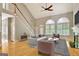 Bright living room features hardwood floors, vaulted ceiling, a fireplace and seating arrangement at 1619 Cascade Overlook, Peachtree City, GA 30269