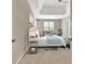 Comfortable main bedroom with sitting area and tray ceiling at 1619 Cascade Overlook, Peachtree City, GA 30269
