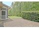 Brick patio overlooking lush green yard at 1619 Cascade Overlook, Peachtree City, GA 30269