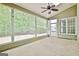 Spacious screened porch with ceiling fan and backyard view at 1619 Cascade Overlook, Peachtree City, GA 30269