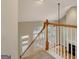 Carpeted staircase featuring white banisters and wood railing leading into the living space at 1619 Cascade Overlook, Peachtree City, GA 30269
