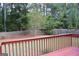 Backyard with a wooden fence and well-manicured lawn viewed from deck at 12214 Cypress Way, Fayetteville, GA 30215