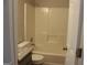Full bathroom with a shower and tub combo and toilet at 12214 Cypress Way, Fayetteville, GA 30215