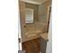 Bright bathtub with tile surround, window with blinds, and wood flooring at 12214 Cypress Way, Fayetteville, GA 30215