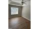 Empty bedroom with updated floors, and a ceiling fan at 12214 Cypress Way, Fayetteville, GA 30215