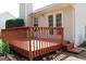 Wooden deck with railing accessible from French doors at 12214 Cypress Way, Fayetteville, GA 30215
