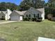 Inviting single-Gathering home featuring a well-maintained lawn and a 2-car garage at 12214 Cypress Way, Fayetteville, GA 30215