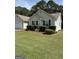 Charming single-story home featuring a well-maintained lawn and classic curb appeal at 12214 Cypress Way, Fayetteville, GA 30215
