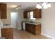 Kitchen featuring granite countertops, wooden cabinets, and modern appliances at 12214 Cypress Way, Fayetteville, GA 30215