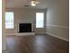Living room with hardwood floors, fireplace, and ceiling fan at 12214 Cypress Way, Fayetteville, GA 30215