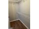 Walk-in closet with built-in wire shelving and wood flooring for organized storage at 12214 Cypress Way, Fayetteville, GA 30215