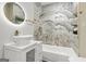 Bathroom featuring a vessel sink and stone-tiled shower and gold hardware accents at 1766 Ware Ave, East Point, GA 30344