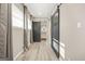 Bright bedroom with barn doors leading to the bathroom and hardwood floors at 1766 Ware Ave, East Point, GA 30344