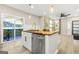 Kitchen with sleek stainless steel dishwasher and a butcher block top island at 1766 Ware Ave, East Point, GA 30344