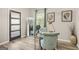 Home office design with light teal furnishings and a neutral color palette at 1766 Ware Ave, East Point, GA 30344