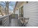 Outdoor sitting area on the wooden porch with white siding at 1766 Ware Ave, East Point, GA 30344