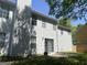 Exterior view of a home's backyard with a patio, sliding glass door access, and a chimney at 345 S Magnolia Se Walk, Atlanta, GA 30349
