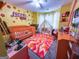Whimsical bedroom featuring a crib, play tent, and colorful decor at 345 S Magnolia Se Walk, Atlanta, GA 30349
