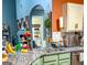 Stylish kitchen showcasing granite countertops, green cabinets, and views to a charming half bathroom at 345 S Magnolia Se Walk, Atlanta, GA 30349