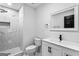 Modern bathroom featuring marble tile, a stylish vanity, and a glass-enclosed shower at 849 Wood Nw St, Atlanta, GA 30318