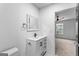 Clean bathroom featuring a white vanity with modern fixtures and a square mirror at 849 Wood Nw St, Atlanta, GA 30318