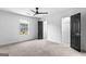 Cozy bedroom features carpet floors, white walls, a ceiling fan and black doors at 849 Wood Nw St, Atlanta, GA 30318