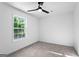 Bedroom with neutral carpet, white walls and a double hung window providing ample natural light at 849 Wood Nw St, Atlanta, GA 30318