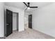 Neutral bedroom with a ceiling fan, closet, and carpet floors at 849 Wood Nw St, Atlanta, GA 30318