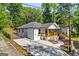 Beautifully renovated house with new concrete driveway, fresh exterior paint, and a inviting wood-railed front porch at 849 Wood Nw St, Atlanta, GA 30318