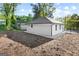 Newly renovated home featuring a white exterior, chain link fence and spacious yard at 849 Wood Nw St, Atlanta, GA 30318