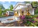 Lovely home with a charming front porch, featuring natural wood railing and beautiful flowering shrubs at 849 Wood Nw St, Atlanta, GA 30318