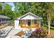 Charming renovated home featuring a cozy front porch with wood railing and well-manicured landscaping at 849 Wood Nw St, Atlanta, GA 30318