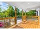Inviting covered front porch with natural wood posts and railing, perfect for relaxing outdoors at 849 Wood Nw St, Atlanta, GA 30318