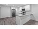 Updated kitchen features modern appliances, granite countertops, and white cabinets at 849 Wood Nw St, Atlanta, GA 30318