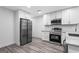 Kitchen with stainless steel appliances, granite counters, and gray LVP flooring at 849 Wood Nw St, Atlanta, GA 30318