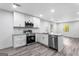 Kitchen featuring stainless steel appliances, granite countertops, and LVP flooring at 849 Wood Nw St, Atlanta, GA 30318