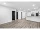 Open concept floor plan boasts hardwood floors, white walls, and recessed lighting at 849 Wood Nw St, Atlanta, GA 30318