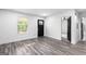 Bright living room featuring a black front door, hardwood floors, and neutral paint at 849 Wood Nw St, Atlanta, GA 30318