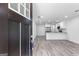 Open-concept living space featuring modern gray floors, recessed lighting, and a stylish kitchen at 849 Wood Nw St, Atlanta, GA 30318