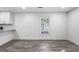 Living room featuring hardwood floors, white walls, and large window with natural light at 849 Wood Nw St, Atlanta, GA 30318