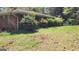 Spacious green backyard with some bushes and trees at 1198 Lynhurst Sw Dr, Atlanta, GA 30311