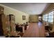 Spacious living room with hardwood floors, large windows, and awaiting renovation at 1198 Lynhurst Sw Dr, Atlanta, GA 30311