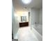 Bathroom with dual sink vanity, soaking tub and tiled flooring at 1605 Hydrangea Ln, Mcdonough, GA 30253
