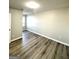 Bedroom with hardwood floors, neutral walls, natural light, and a closet at 1605 Hydrangea Ln, Mcdonough, GA 30253